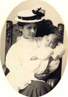 Fanny Taylor Dunham (mother) holding baby, Albert Jr. (brother), ca. 1910.