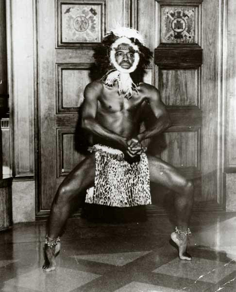 Dunham performer Ural Wilson in African headdress and garb, n.d. 