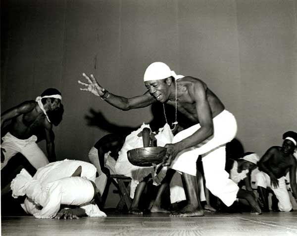 Troupe of Dunham dancers (featuring Sylvester “Sunshine” Lee) performing in a tribute to Katherine Dunham during the Albert Schweitzer Award ceremony, 1979.