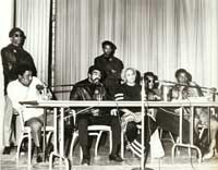 Katherine Dunham and Eugene Redmond with Rev. Charles Koen and other members of the Black Egyptians, 1968–1969. 