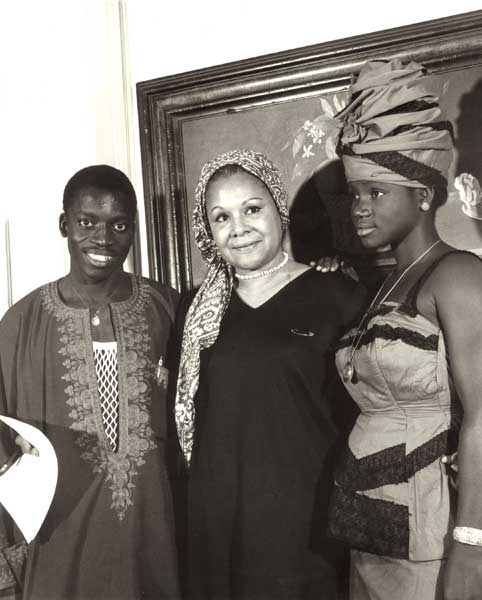 Katherine Dunham posing with Senegalese master of the djembe.